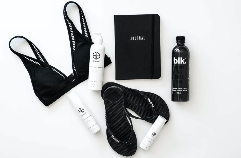 black bathing suit and flip flops