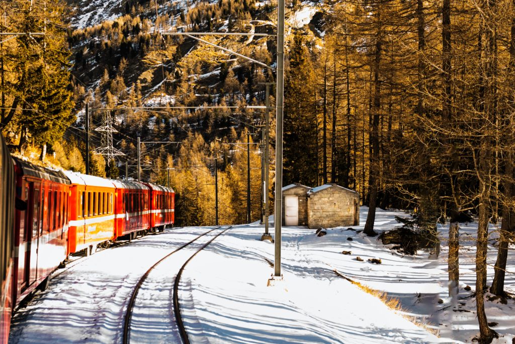 Train on tracks through the snow