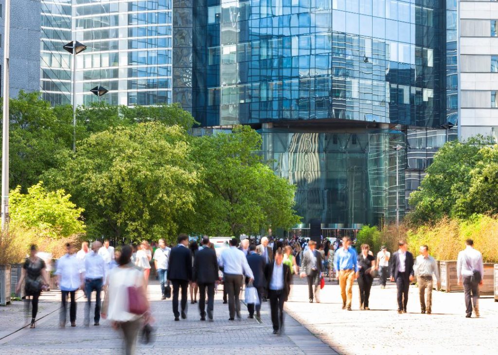 Blurred business people walking to work in France.