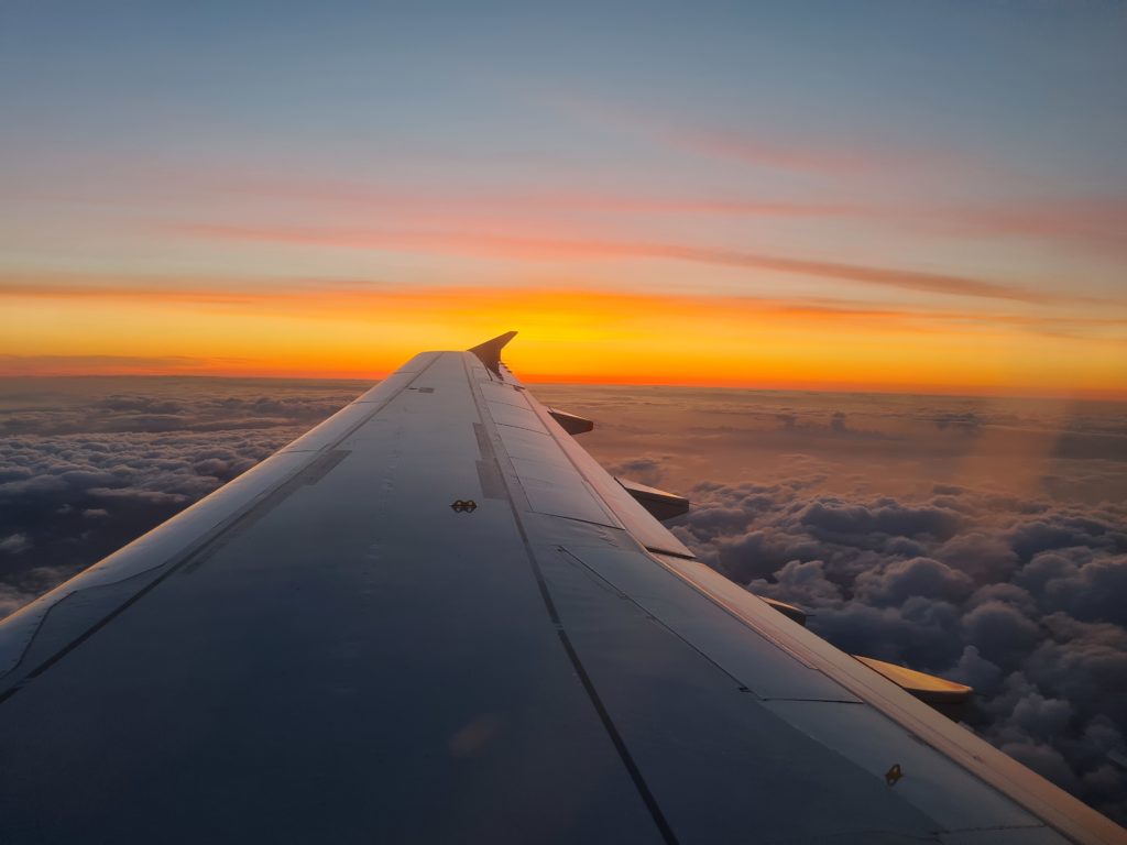 Sunset with wing of plane