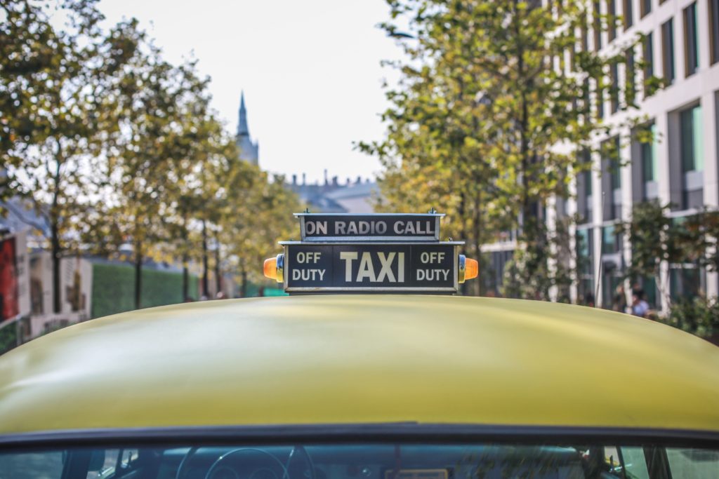 Yellow taxi sign on duty