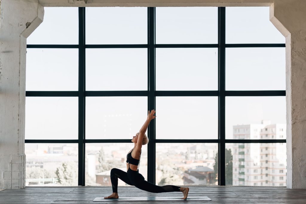 Woman doing yoga with a view