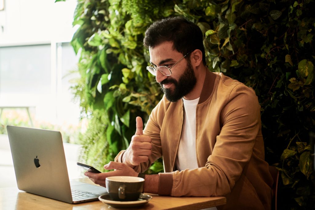 Man on laptop at airport