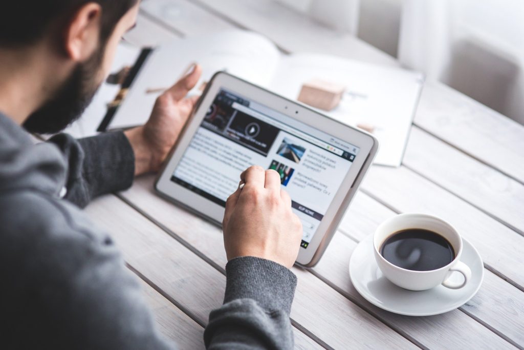 Man reading from ipad
