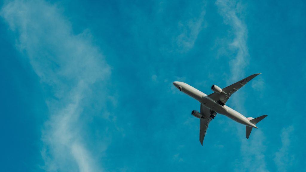 Airplane flying blue sky