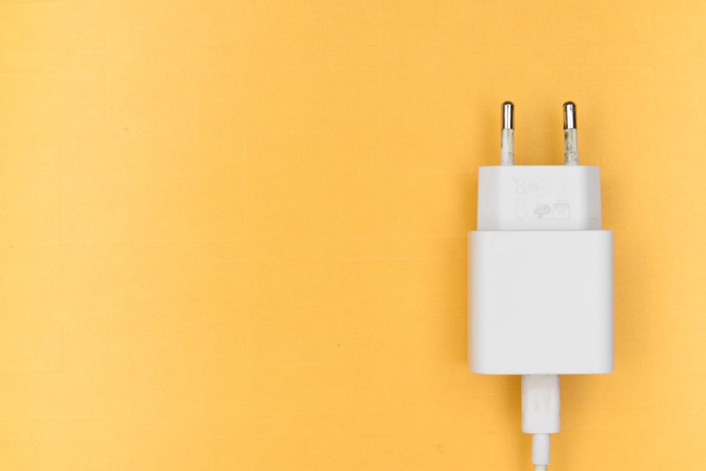 Phone charger yellow background