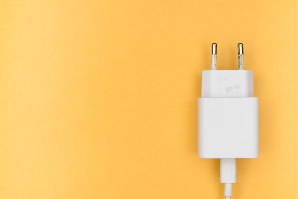 Phone charger yellow background