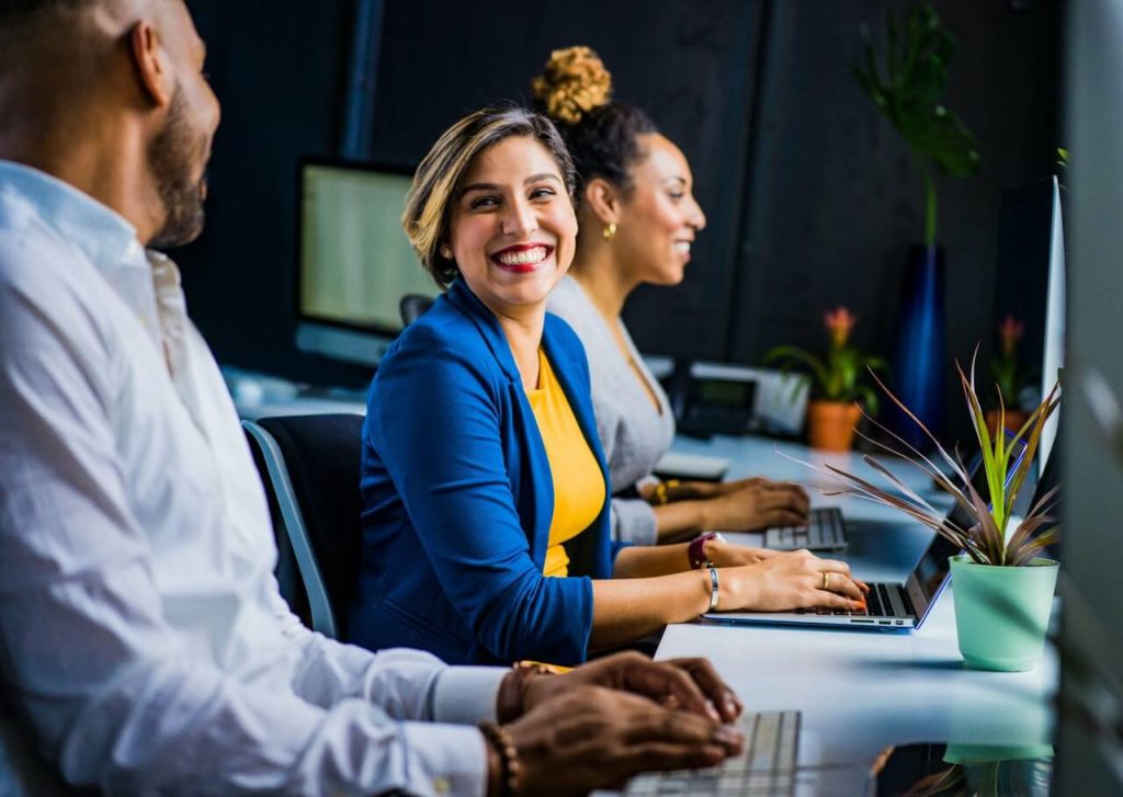 woman smiling at colleague