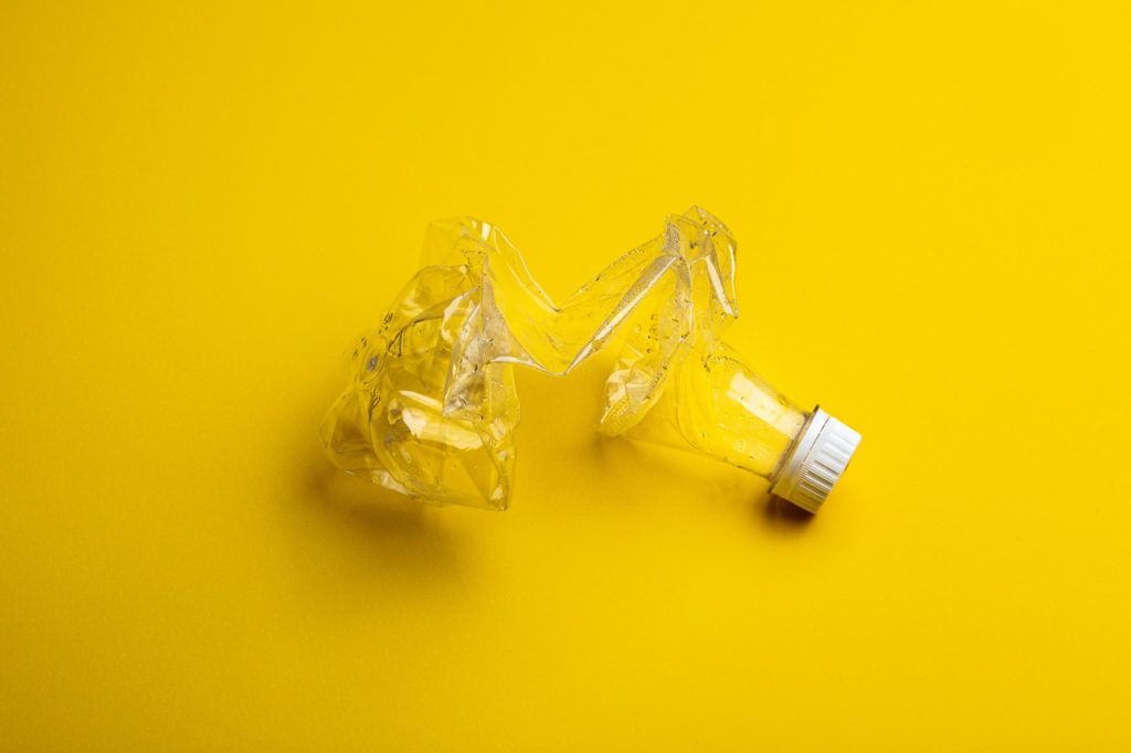 Plastic bottle yellow background