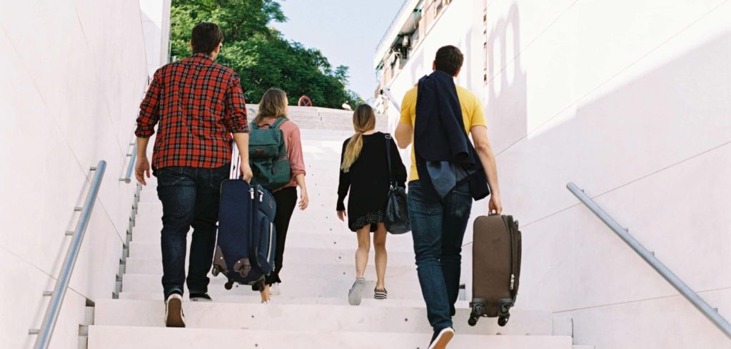 Suitcases up stairs